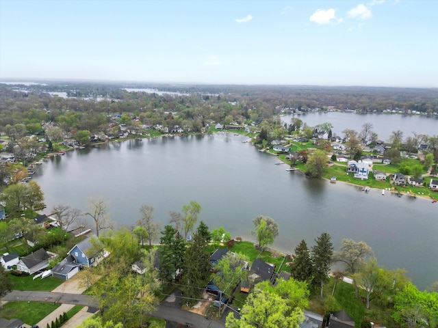 birds eye view of property with a water view and a residential view
