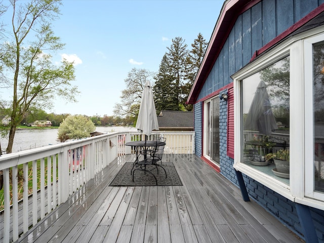 wooden deck with a water view