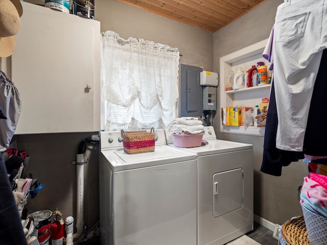 washroom featuring laundry area, wood ceiling, electric panel, and separate washer and dryer