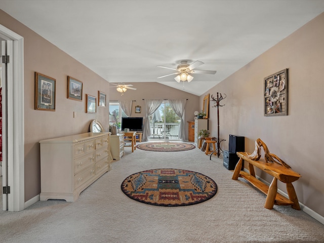 living room with carpet floors, baseboards, ceiling fan, and vaulted ceiling