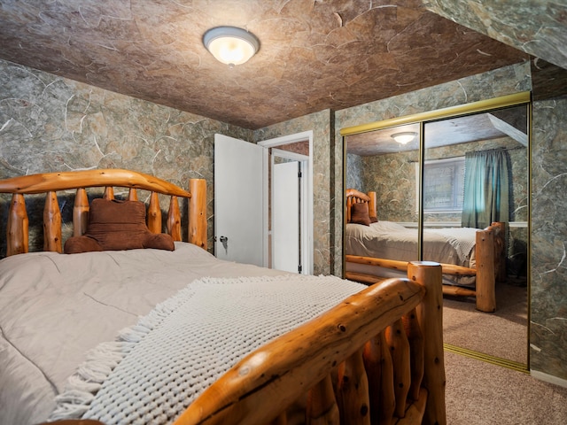 bedroom with a closet and carpet flooring