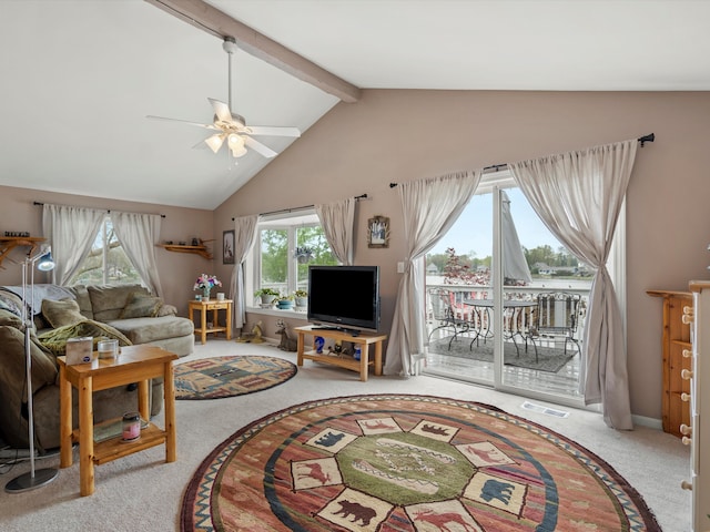 living room with carpet floors, ceiling fan, a wealth of natural light, and visible vents
