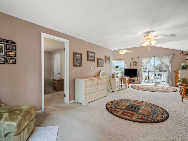 living room featuring baseboards, a ceiling fan, and light carpet