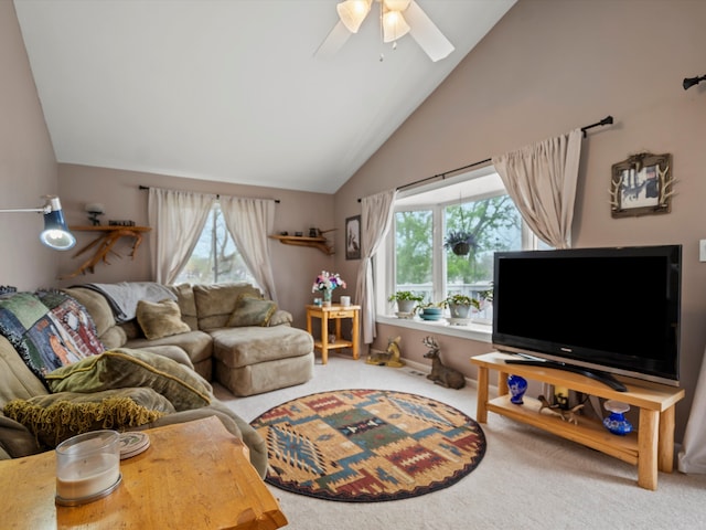 living room featuring carpet floors, a ceiling fan, and high vaulted ceiling