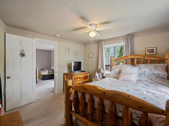 bedroom featuring a ceiling fan and light carpet