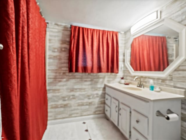 bathroom with vanity and tile patterned floors