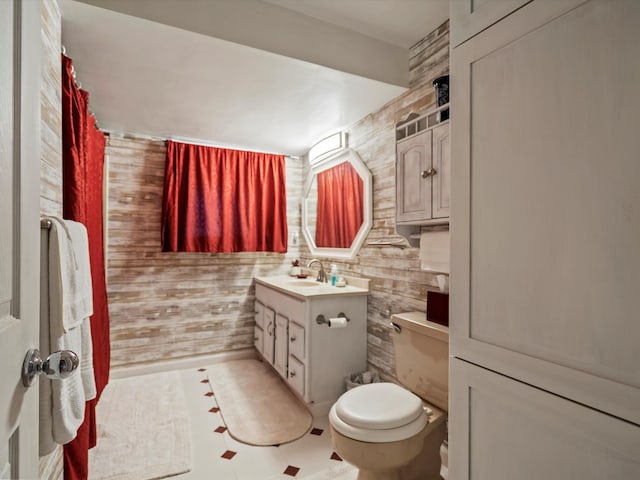 full bath featuring vanity and toilet
