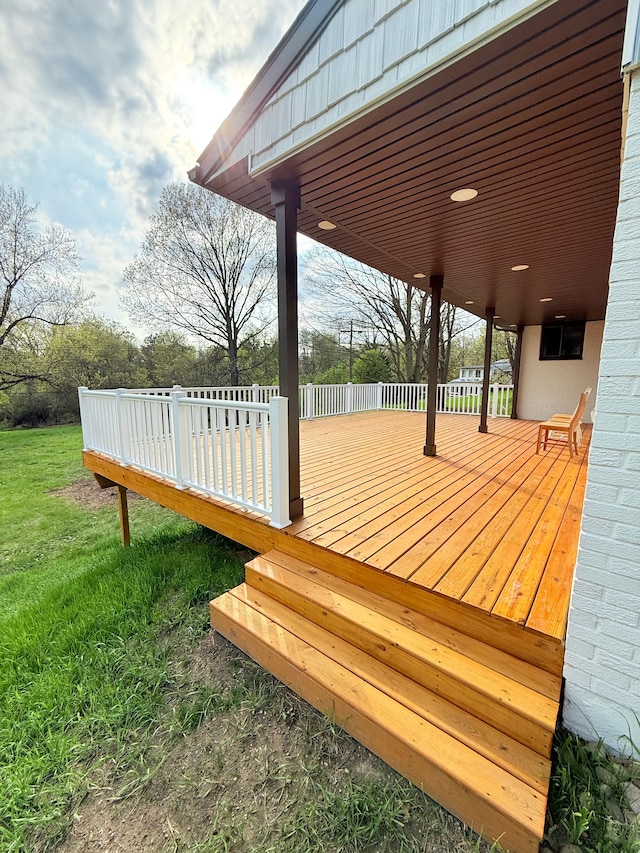 wooden terrace with a yard