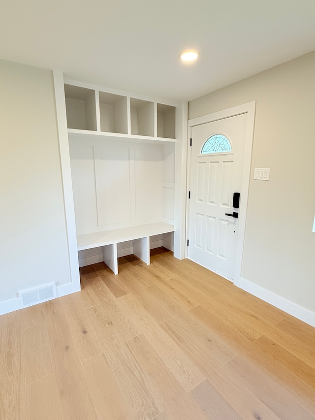 mudroom featuring recessed lighting, baseboards, visible vents, and light wood-type flooring