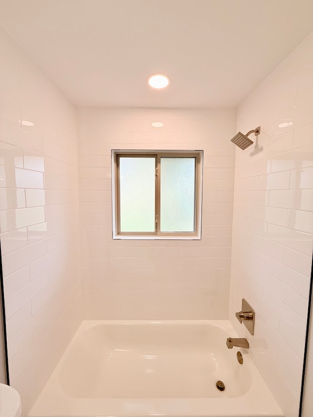 full bathroom with recessed lighting, washtub / shower combination, and toilet