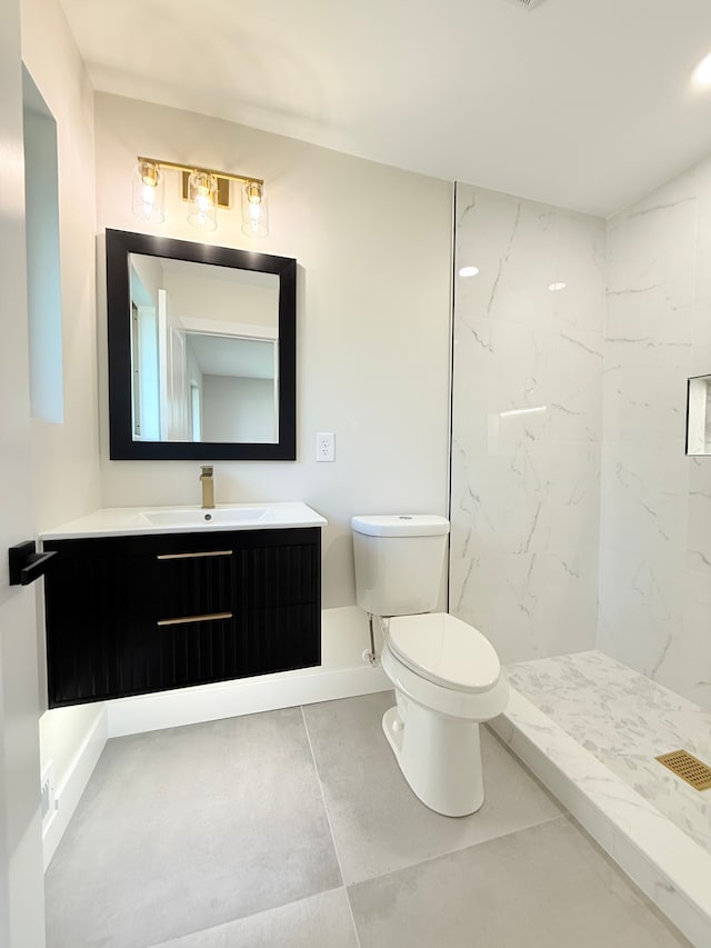 full bathroom with vanity, a marble finish shower, and toilet