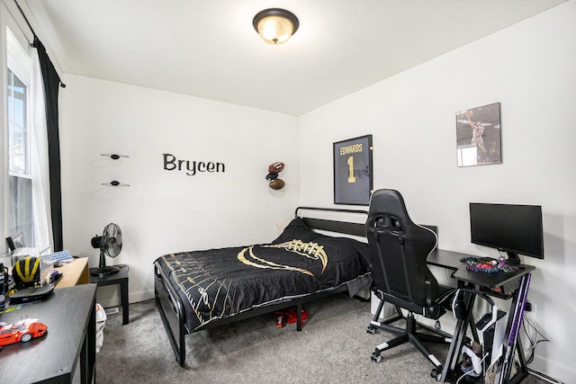 bedroom with baseboards and carpet flooring