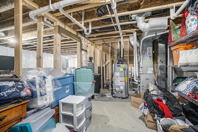 unfinished basement featuring gas water heater