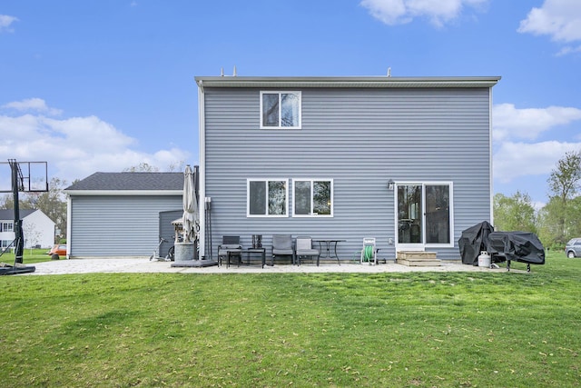 back of house with a lawn, entry steps, and a patio area