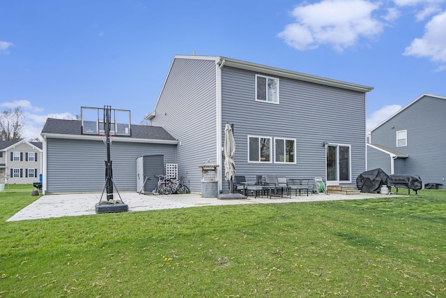 rear view of house featuring a yard, a patio, and entry steps