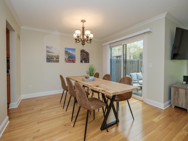 dining area with crown molding, baseboards, light wood-type flooring, and a notable chandelier