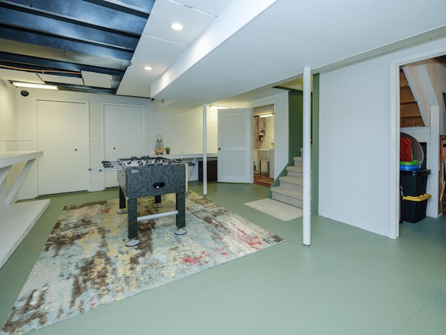 game room with recessed lighting and finished concrete floors