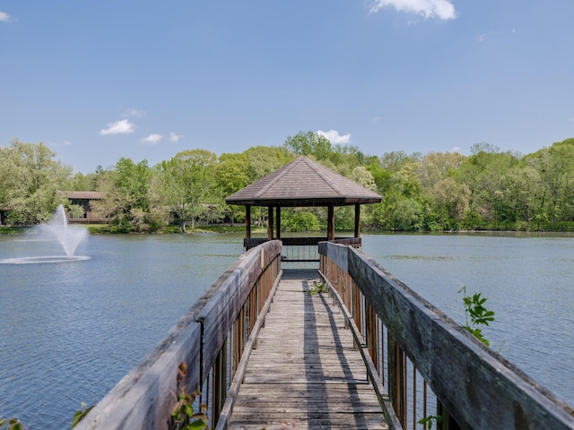 3603 Woodcliff Dr, Kalamazoo, MI 49008 - dock featuring a gazebo, a water view, and a view of trees