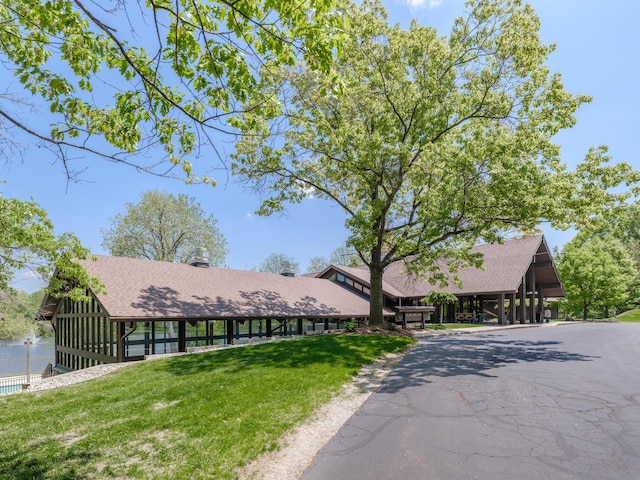 3603 Woodcliff Dr, Kalamazoo, MI 49008 - view of front of property featuring a front yard and a shingled roof