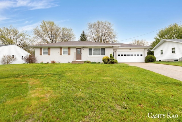 7116 Linden Ave SE, Grand Rapids, MI 49548 - ranch-style house with concrete driveway, brick siding, an attached garage, and a front yard