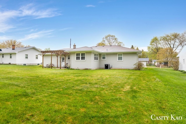 7116 Linden Ave SE, Grand Rapids, MI 49548 - rear view of property featuring a lawn, a pergola, and a chimney