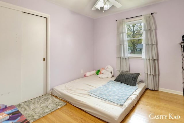 7116 Linden Ave SE, Grand Rapids, MI 49548 - bedroom with baseboards, ceiling fan, wood finished floors, and a closet