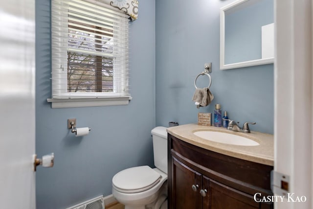 7116 Linden Ave SE, Grand Rapids, MI 49548 - bathroom with toilet, visible vents, and vanity