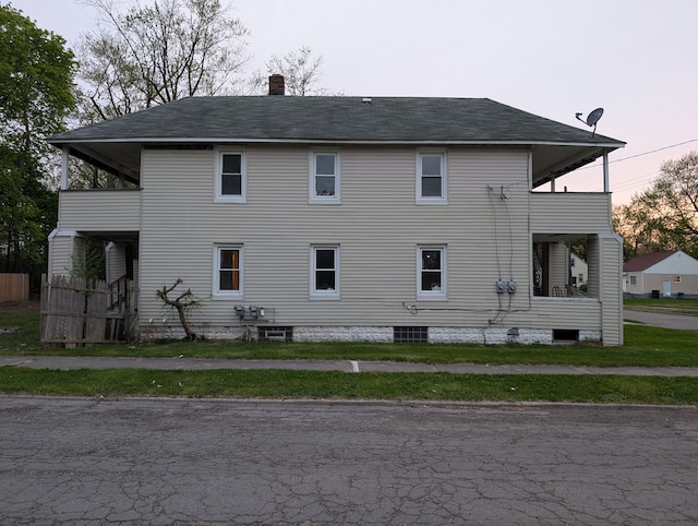 249 W Wilson Ave, Pontiac, MI 48341 - back of property with a chimney and roof with shingles