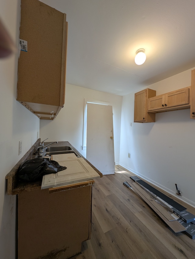 249 W Wilson Ave, Pontiac, MI 48341 - kitchen featuring a sink, baseboards, light brown cabinetry, and wood finished floors