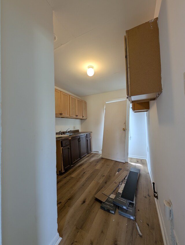 249 W Wilson Ave, Pontiac, MI 48341 - kitchen featuring light wood-style floors, a sink, baseboards, and light brown cabinets
