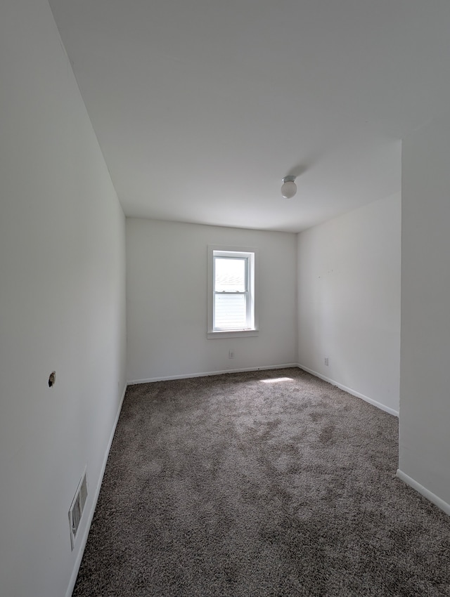 249 W Wilson Ave, Pontiac, MI 48341 - carpeted empty room featuring visible vents and baseboards