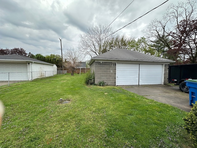 detached garage featuring fence