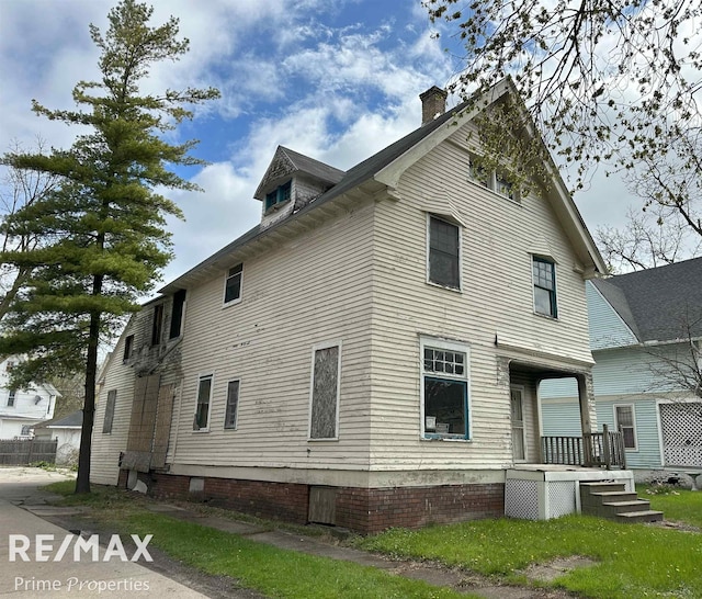 view of home's exterior with a chimney