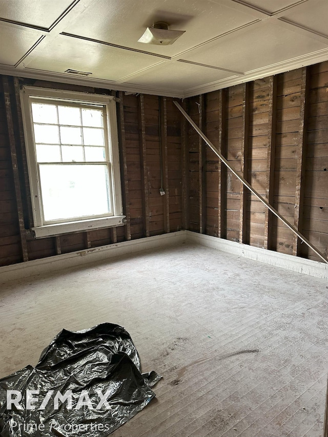 unfurnished room with visible vents