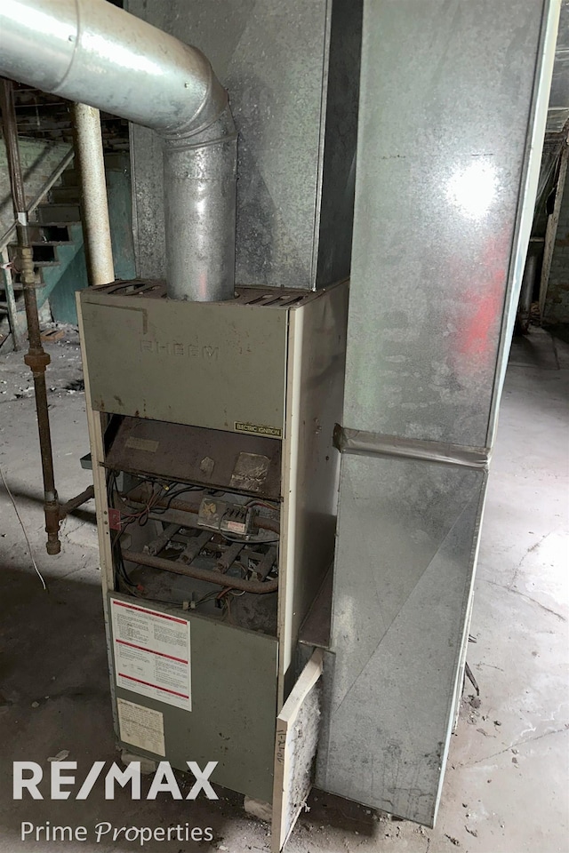 utility room featuring heating unit