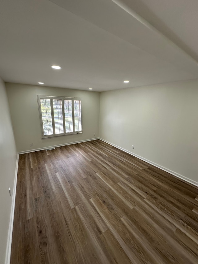 9615 Woodland Ct, Ypsilanti, MI 48197 - unfurnished room featuring recessed lighting, baseboards, and dark wood-type flooring
