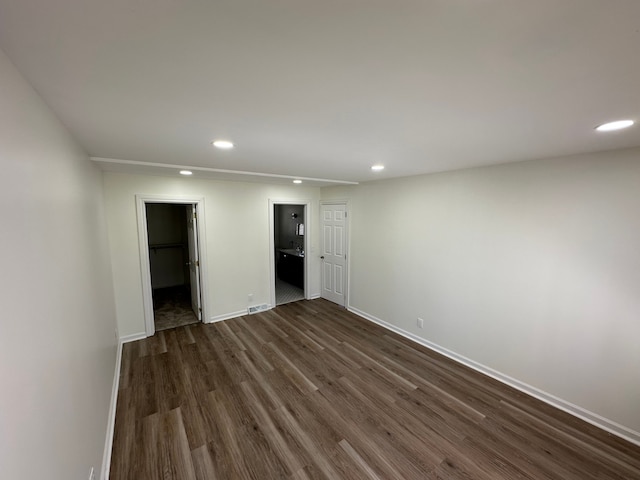 9615 Woodland Ct, Ypsilanti, MI 48197 - spare room with recessed lighting, baseboards, dark wood-style flooring, and visible vents