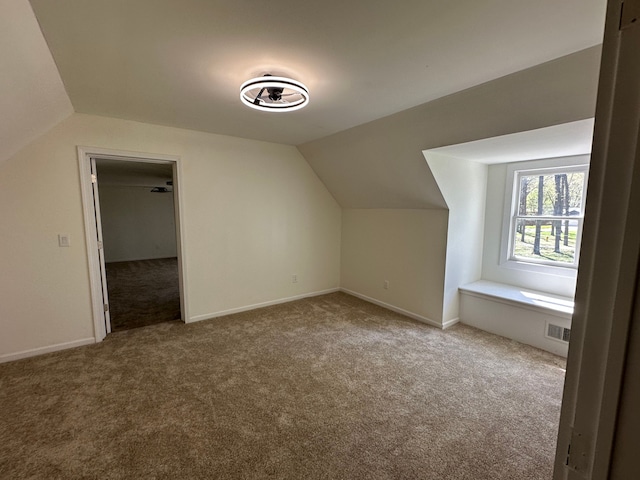 9615 Woodland Ct, Ypsilanti, MI 48197 - bonus room featuring carpet flooring, baseboards, vaulted ceiling, and visible vents