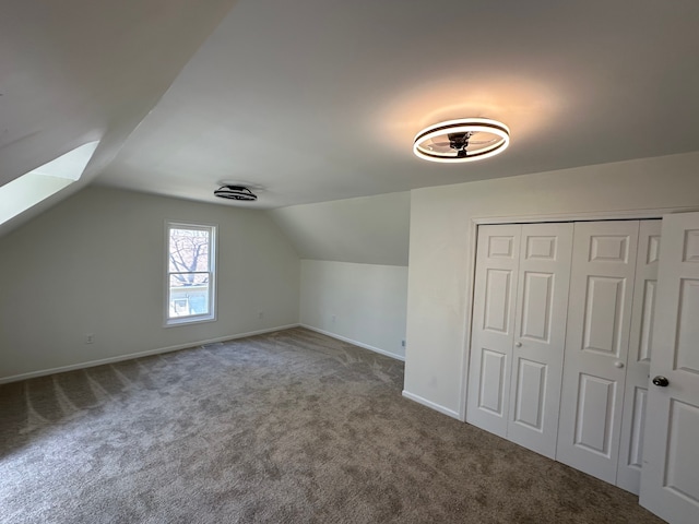 9615 Woodland Ct, Ypsilanti, MI 48197 - bonus room featuring baseboards, carpet flooring, and lofted ceiling