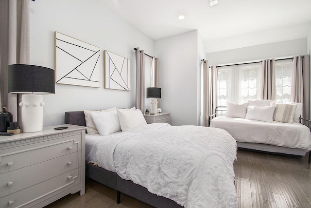 bedroom featuring recessed lighting and wood finished floors