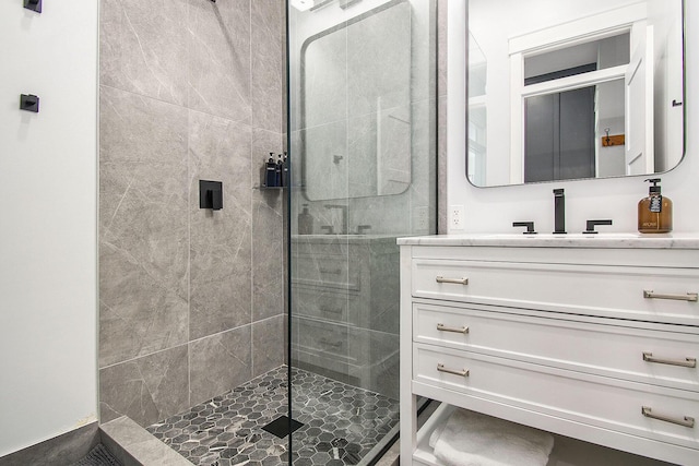 bathroom with vanity and a stall shower