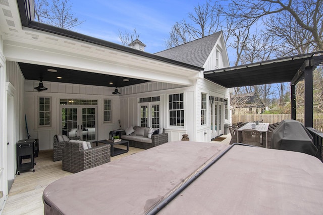 wooden deck featuring fence, an outdoor living space, french doors, and outdoor dining space