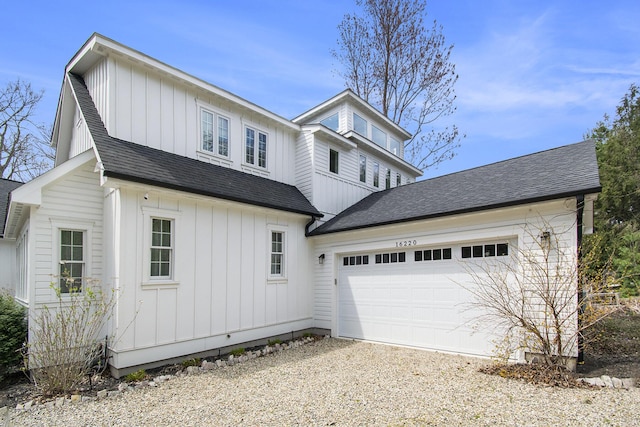 modern farmhouse featuring board and batten siding, driveway, roof with shingles, and a garage