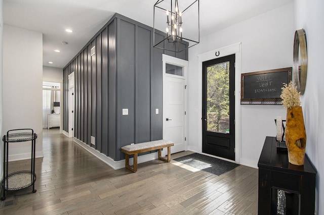 entrance foyer with an inviting chandelier, recessed lighting, wood finished floors, and a wealth of natural light