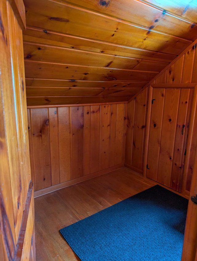 2326 Southampton Ave, Grand Blanc, MI 48507 - additional living space with wood ceiling, wood walls, lofted ceiling, and wood-type flooring