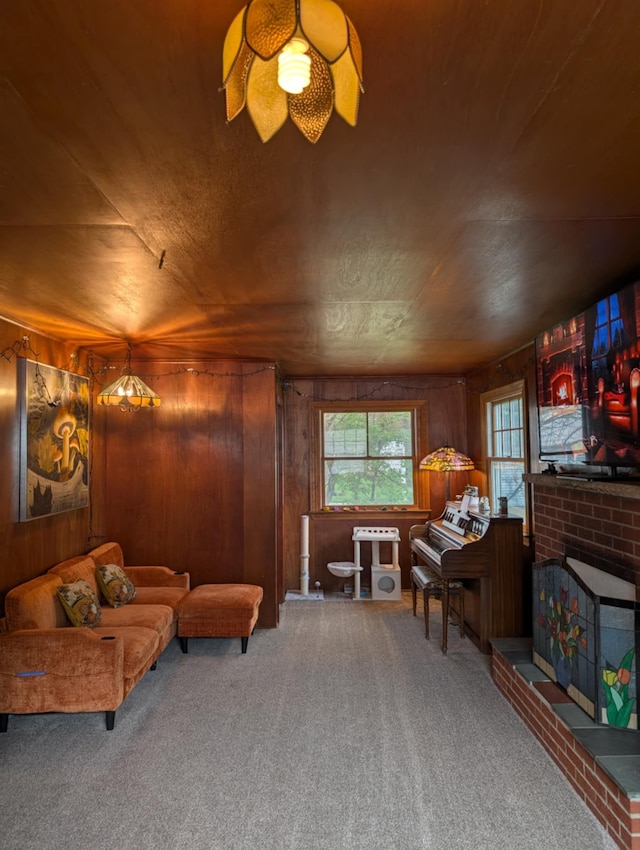 2326 Southampton Ave, Grand Blanc, MI 48507 - living area featuring wooden walls, a brick fireplace, and carpet floors