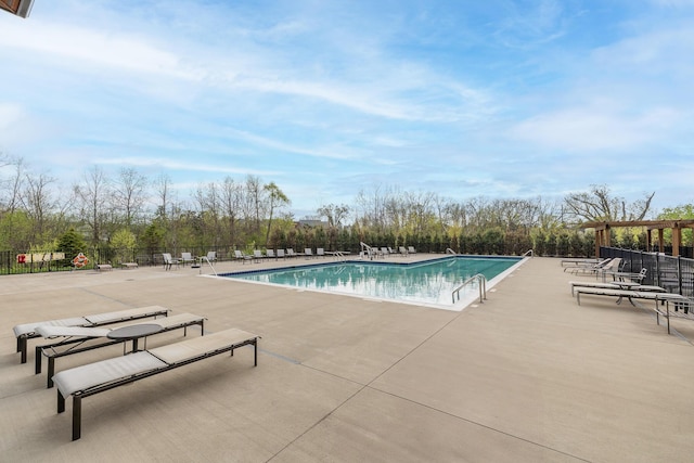 pool with fence and a patio area