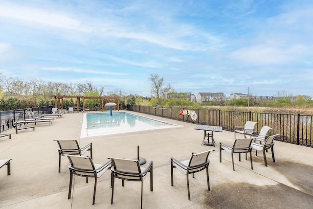 pool featuring a patio and fence
