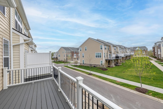 wooden terrace featuring a residential view