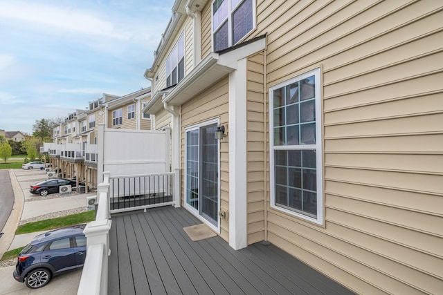 wooden deck with a residential view